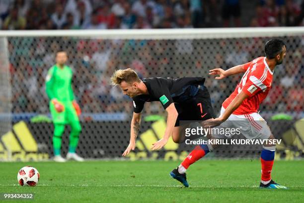 Croatia's midfielder Ivan Rakitic and Russia's midfielder Alexander Samedov vie for the ball during the Russia 2018 World Cup quarter-final football...