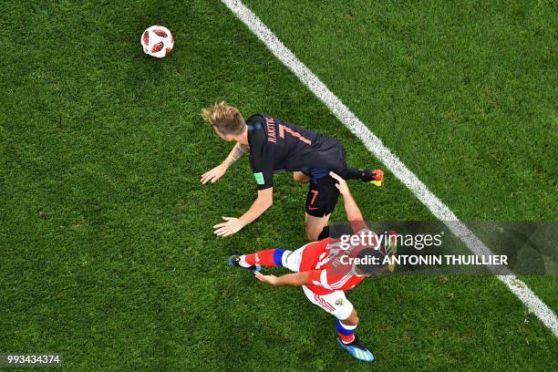 Croatia's midfielder Ivan Rakitic vies with Russia's midfielder Alexander Samedov during the Russia 2018 World Cup quarter-final football match...