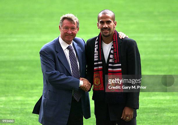 New Manchester United signing Juan Sebastien Veron is unveiled by Manager Sir Alex Ferguson at a press conference and photocall at Old Trafford,...