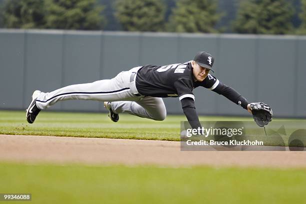 Gordon Beckham of the Chicago White Sox dives for a ball hit by the Minnesota Twins on May 12, 2010 at Target Field in Minneapolis, Minnesota. The...