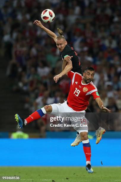 Domagoj Vida of Croatia wins a header over Alexandr Samedov of Russia during the 2018 FIFA World Cup Russia Quarter Final match between Russia and...