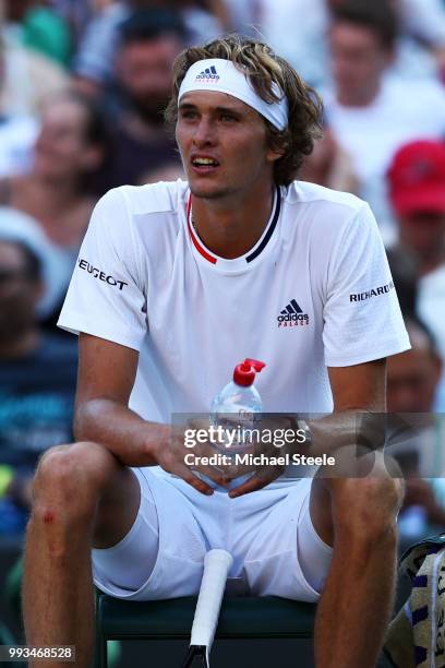 Alexander Zverev of Germany looks on against Ernests Gulbis of Latvia during their Men's Singles third round match on day six of the Wimbledon Lawn...