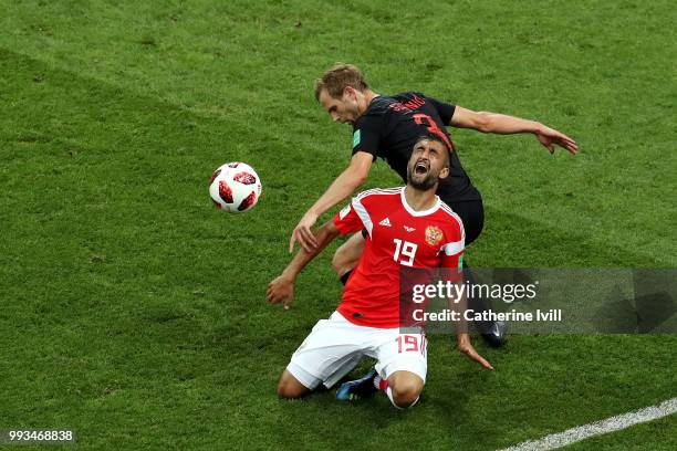 Alexander Samedov of Russia is challenged by Ivan Strinic of Croatia during the 2018 FIFA World Cup Russia Quarter Final match between Russia and...