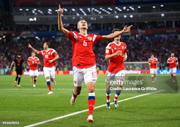 Denis Cheryshev of Russia celebrates after scoring his team's first goal during the 2018 FIFA World Cup Russia Quarter Final match between Russia and...