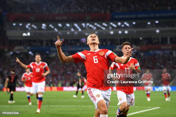 Denis Cheryshev of Russia celebrates after scoring his team's first goal during the 2018 FIFA World Cup Russia Quarter Final match between Russia and...