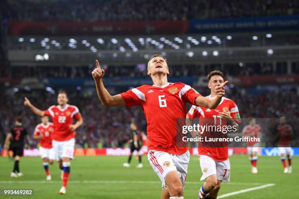 Denis Cheryshev of Russia celebrates after scoring his team's first goal during the 2018 FIFA World Cup Russia Quarter Final match between Russia and...