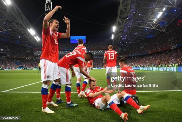 Denis Cheryshev of Russia celebrates with team mates after scoring his team's first goal during the 2018 FIFA World Cup Russia Quarter Final match...