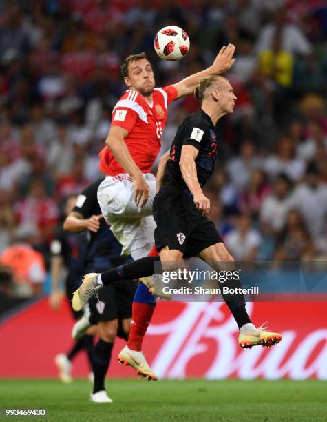 Artem Dzyuba of Russia wins a header from Domagoj Vida of Croatia during the 2018 FIFA World Cup Russia Quarter Final match between Russia and...