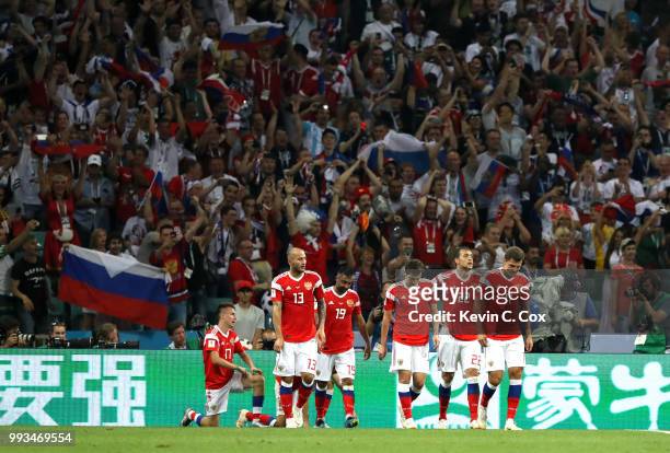 Denis Cheryshev of Russia celebrates with team mates after scoring his team's first goal during the 2018 FIFA World Cup Russia Quarter Final match...