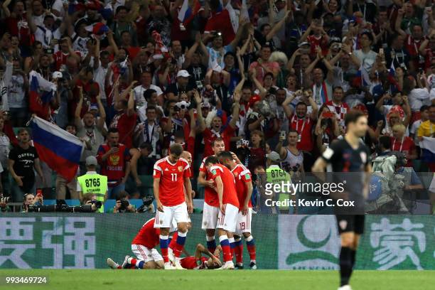 Denis Cheryshev of Russia celebrates with team mates after scoring his team's first goal during the 2018 FIFA World Cup Russia Quarter Final match...