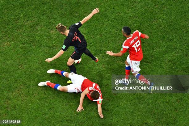 Croatia's midfielder Ivan Rakitic vies with Russia's midfielder Alexander Samedov during the Russia 2018 World Cup quarter-final football match...