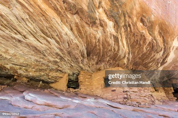 house on fire, former grain storage under a rock overhang, mule canyon, utah, united states - rock overhang stock pictures, royalty-free photos & images