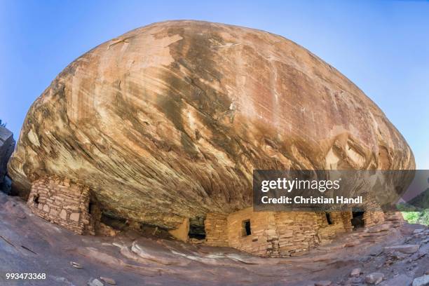 house on fire, former grain storage under a rock overhang, mule canyon, utah, united states - rock overhang foto e immagini stock