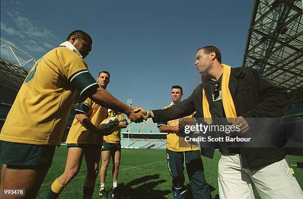 Australian cricketer Michael Bevan meets the Australian wallabies during the Australian Wallabies training session in preparation for the third test...