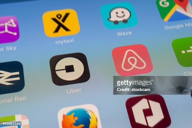 uber, airbnb and other travel apps on ipad screen - mozilla firefox stock pictures, royalty-free photos & images