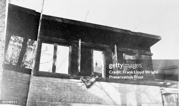 Hazel Wright in east window of garage apartment before exterior stair added, at the Frank Lloyd Wright Home and Studio, located at 951 Chicago...