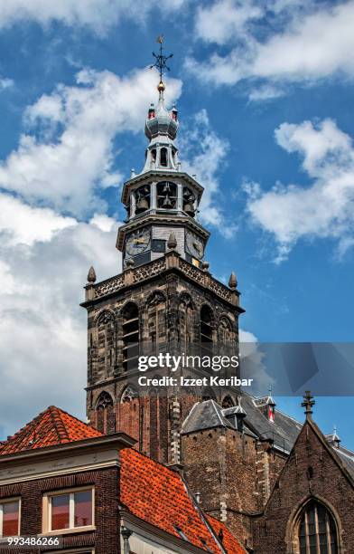 clock and bell tower of st john's cathedral in  gouda, netherlands - gouda stock pictures, royalty-free photos & images