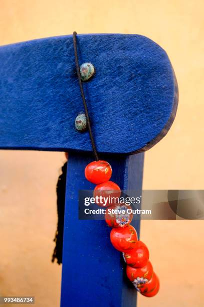 greek lifestyle - worry beads hanging on a chair, crete, greece - greek worry beads stock pictures, royalty-free photos & images