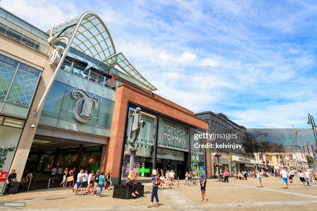 Shoppers walking by the Trinity shopping centre in Leeds