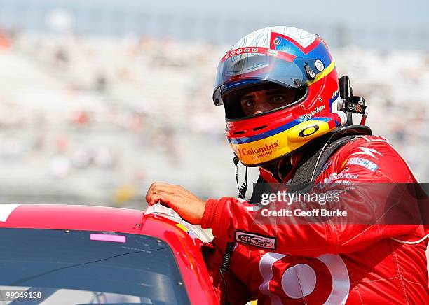 Juan Pablo Montoya, driver of the Target Chevrolet, gets out of his car after qualifying for the NASCAR Sprint Cup Series Autism Speaks 400 at Dover...