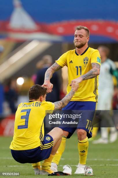 Victor Lindelof and John Guidetti of Sweden are upset after losing against England on the 2018 FIFA World Cup Russia quarter final match between...