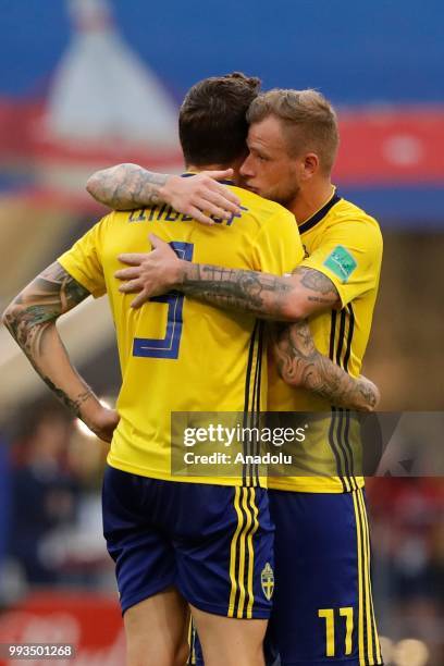 Victor Lindelof and John Guidetti of Sweden are upset after losing against England on the 2018 FIFA World Cup Russia quarter final match between...