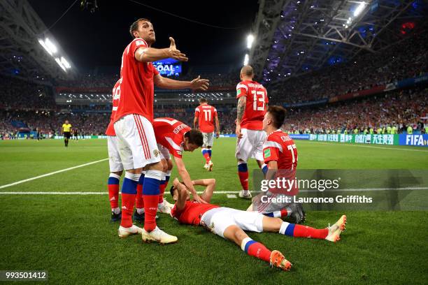 Denis Cheryshev of Russia celebrates with team mates after scoring his team's first goal during the 2018 FIFA World Cup Russia Quarter Final match...