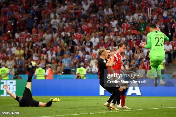Artem Dzyuba of Russia's attempt is saved by Danijel Subasic of Croatia during the 2018 FIFA World Cup Russia Quarter Final match between Russia and...