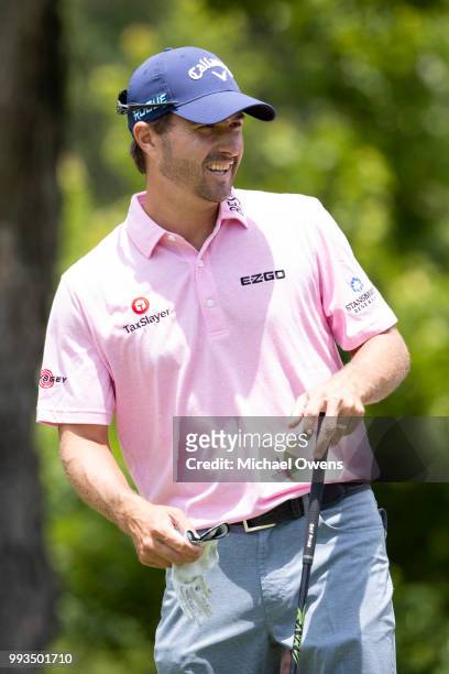 Kevin Kisner laughs before hitting his tee shot on the 12th tee during round three of A Military Tribute At The Greenbrier held at the Old White TPC...