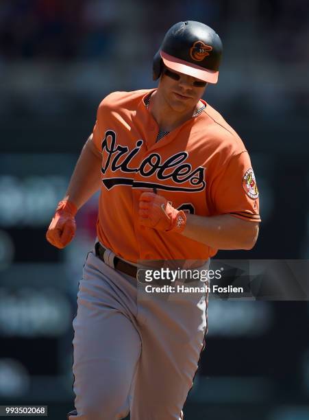 Chris Davis of the Baltimore Orioles rounds the bases after hitting a two-run home run against the Minnesota Twins during the first inning of the...