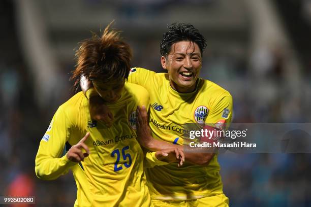 Koya Yuruki and Takumi Yamada of Montedio Yamagata celebrate the first goal during the J.League J2 match between Yokohama FC and Montedio Yamagata at...