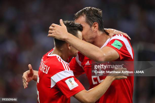 Denis Cheryshev of Russia celebrates scoring a goal to make it 1-0 with Artem Dzyuba of Russia during the 2018 FIFA World Cup Russia Quarter Final...