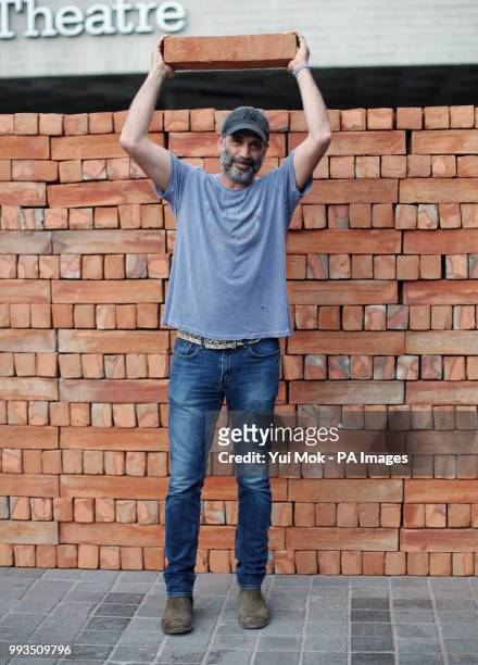 Mexican artist Bosco Sodi poses next to his artwork Muro, a wall built on London's South Bank to protest against US President Donald Trump. The wall,...