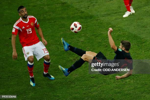 Russia's midfielder Alexander Samedov vies with Croatia's forward Andrej Kramaric during the Russia 2018 World Cup quarter-final football match...