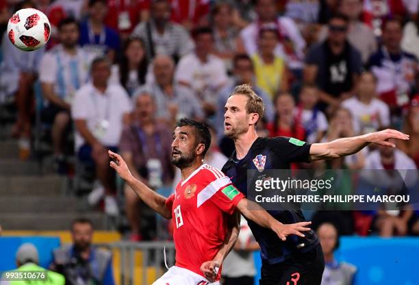 Russia's midfielder Alexander Samedov challenges Croatia's defender Ivan Strinic during the Russia 2018 World Cup quarter-final football match...