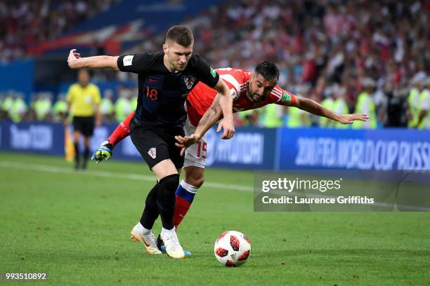 Ante Rebic of Croatia battles for possession with Alexander Samedov of Russia during the 2018 FIFA World Cup Russia Quarter Final match between...