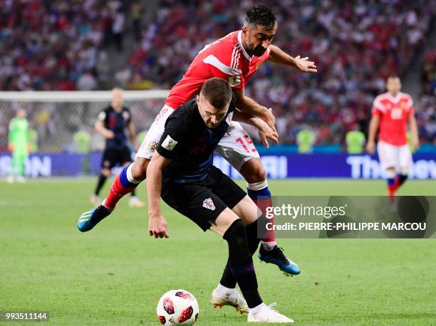 Croatia's forward Ante Rebic challenges Russia's midfielder Alexander Samedov during the Russia 2018 World Cup quarter-final football match between...