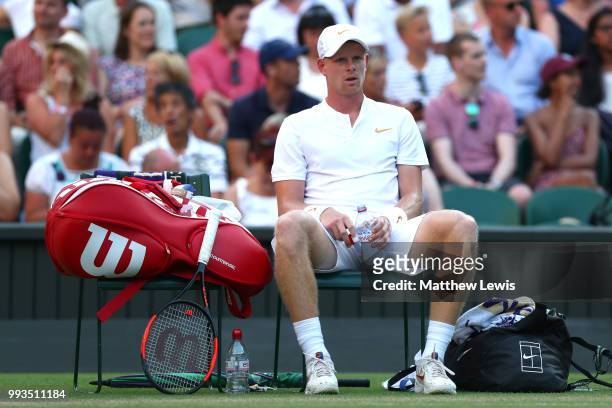Kyle Edmund of Great Britain looks on during a break in play against Novak Djokovic of Serbia in their Men's Singles third round match on day six of...