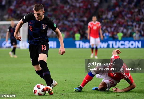 Russia's midfielder Alexander Samedov challenges Croatia's forward Ante Rebic during the Russia 2018 World Cup quarter-final football match between...