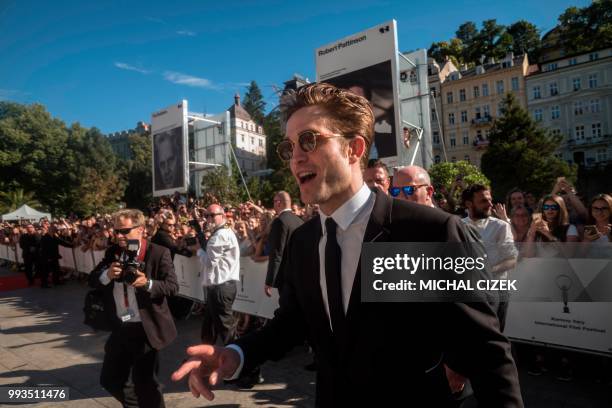 British actor Robert Pattinson poses at the red carpet during the closing of the 53rd Karlovy Vary International Film Festival in Karlovy Vary on...