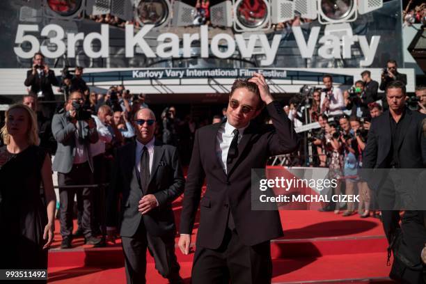 British actor Robert Pattinson poses at the red carpet during the closing of the 53rd Karlovy Vary International Film Festival in Karlovy Vary on...