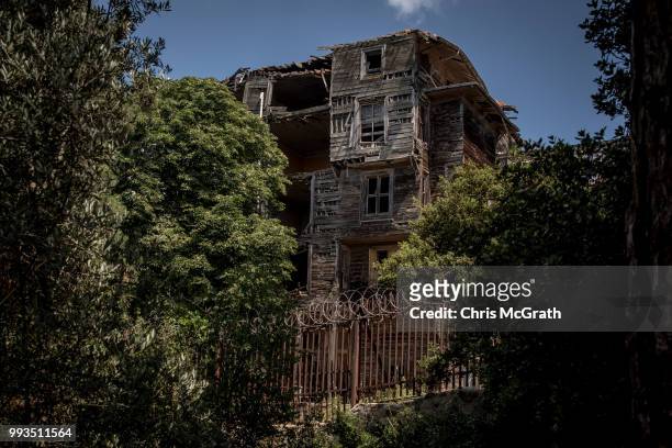 The exterior of the dilapidated Prinkipo Greek Orthodox Orphanage, is seen on July 7, 2018 in Buyukada, Turkey. The historic 20,000-square-meter...
