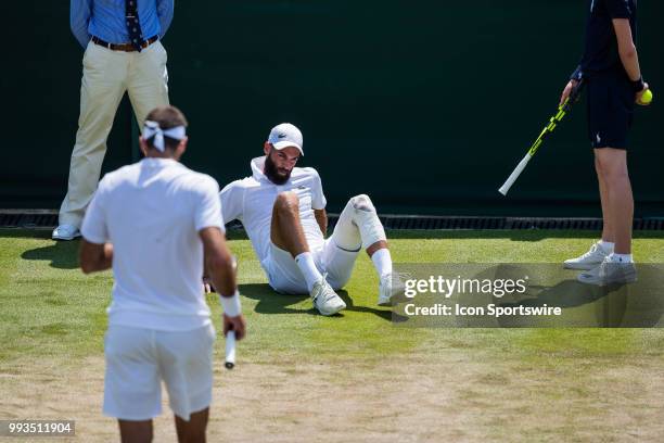 And BENOIT PAIRE during a day six match of the 2018 Wimbledon on July 7 at All England Lawn Tennis and Croquet Club in London, England.