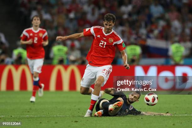 Marcelo Brozovic of Croatia tackles Aleksandr Erokhin of Russia during the 2018 FIFA World Cup Russia Quarter Final match between Russia and Croatia...