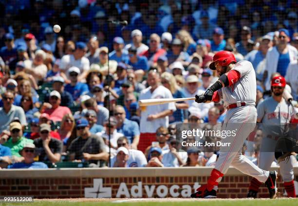 Eugenio Suarez of the Cincinnati Reds hits a three run home run against the Chicago Cubs during the third inning at Wrigley Field on July 7, 2018 in...