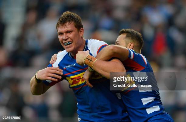 Cobus Wiese of the Stormers celerbate with Dewaldt Duvenage of the Stormers after scoring a try during the Super Rugby match between DHL Stormers and...