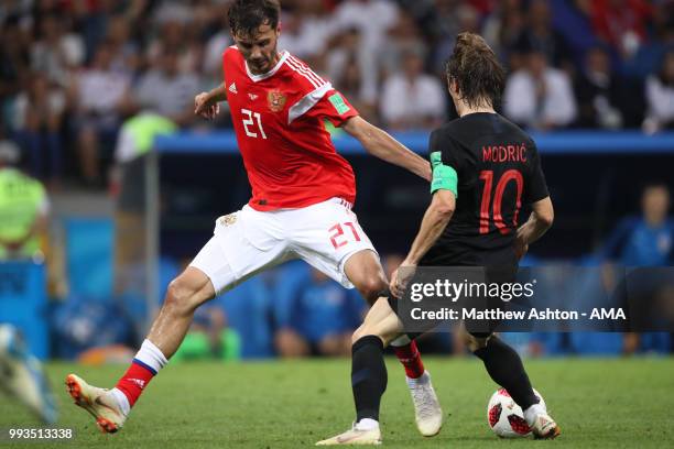 Aleksandr Erokhin of Russia competes with Luka Modric of Croatia during the 2018 FIFA World Cup Russia Quarter Final match between Russia and Croatia...