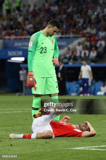 Danijel Subasic of Croatia watches Aleksandr Erokhin of Russia liying on the pitch injured during the 2018 FIFA World Cup Russia Quarter Final match...