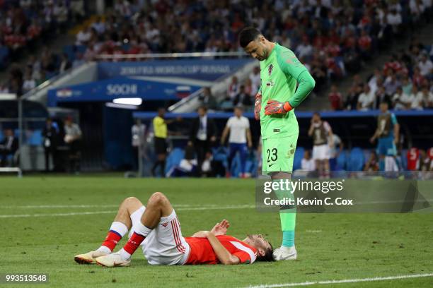 Danijel Subasic of Croatia watches Aleksandr Erokhin of Russia liying on the pitch injured during the 2018 FIFA World Cup Russia Quarter Final match...