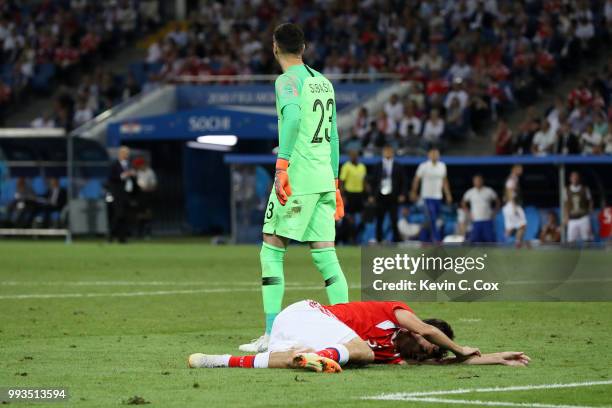 Danijel Subasic of Croatia looks on while Aleksandr Erokhin of Russia lies on the pitch injured during the 2018 FIFA World Cup Russia Quarter Final...